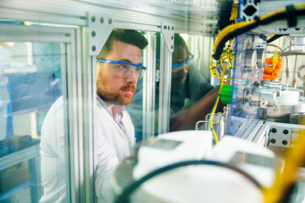 PhD student Conner Pope and Dr. Nour Abdoulmoumine work on the CO2-to-jet fuel reactor in the Bioenergy and Biofuels Lab